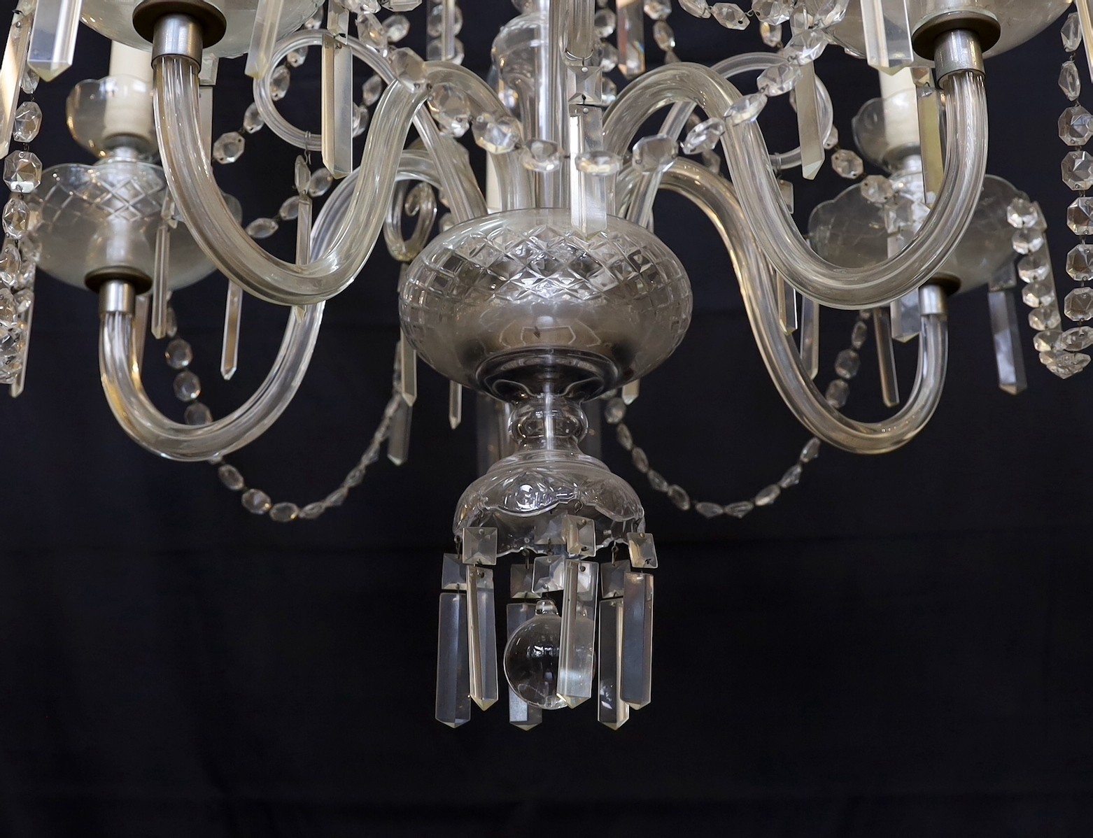 A 1930s Czech cut glass five light chandelier with octagonal bead and bayonet drops, height 100cm. width 65cm